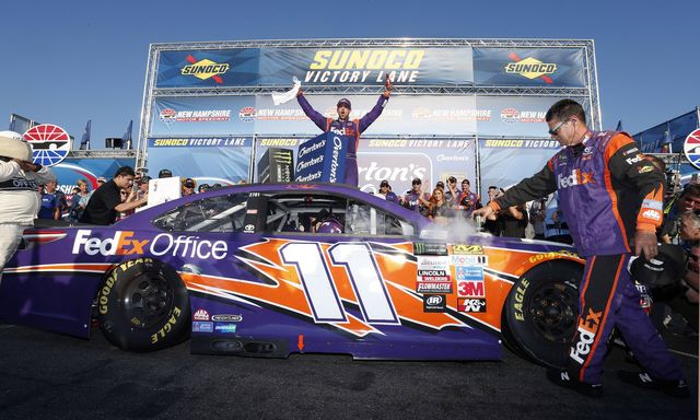 Denny Hamlin celebrates his third-career win at New Hampshire Motor Speedway following his win in Sunday's Overton's 301.