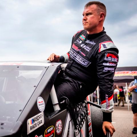 NASCAR Cup Series driver and Berlin, Conn. native Ryan Preece gets in to his Modified race car before the Mohegan Sun 100 NASCAR Whelen Modified Tour race at New Hampshire Motor Speedway on June 22, 2024.