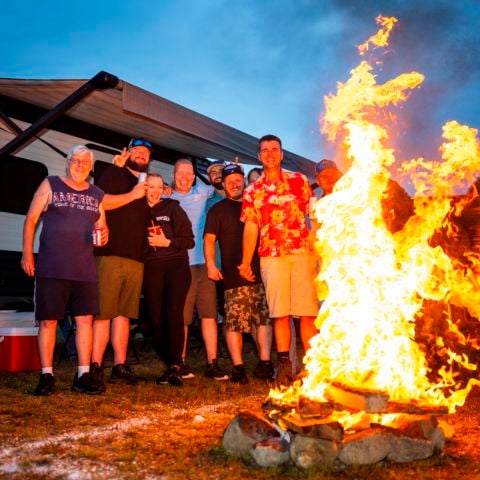 A group of campers enjoy their campsite at New Hampshire Motor Speedway in June 2024.