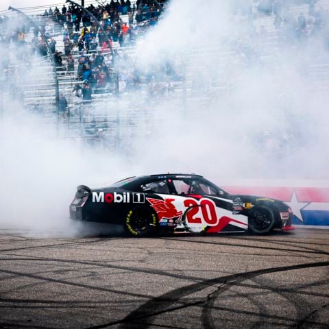NASCAR Cup Series driver Christopher Bell celebrates his NASCAR Xfinity Series win at New Hampshire Motor Speedway in the No. 20 Mobil 1 Toyota Supra for Joe Gibbs Racing on June 22, 2024.