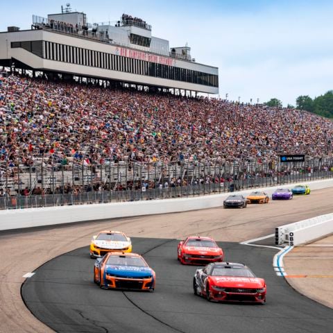 The NASCAR Cup Series field races down the frontstretch at New Hampshire Motor Speedway on June 23, 2024.