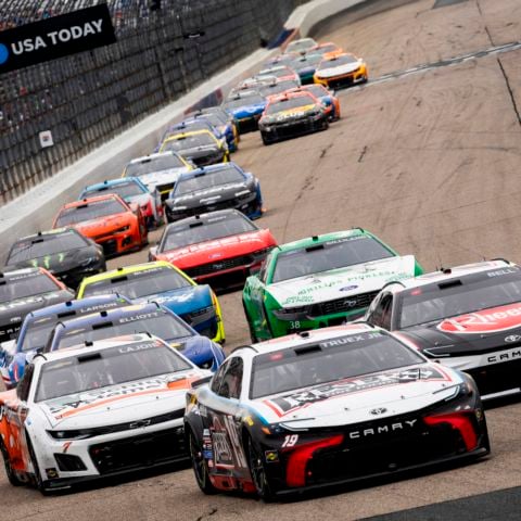 Martin Truex Jr. leads the NASCAR Cup Series field into turn one at New Hampshire Motor Speedway on June 23, 2024.