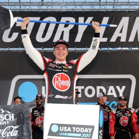Christopher Bell, driver of the No. 20 Joe Gibbs Racing Toyota, celebrates in victory lane after winning the NASCAR Cup Series race and completing the weekend sweep at New Hampshire Motor Speedway on June 23, 2024.