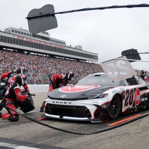Christopher Bell, driver of the No. 20 Joe Gibbs Racing Toyota, makes a pit stop during the NASCAR Cup Series race at New Hampshire Motor Speedway on June 23, 2024.