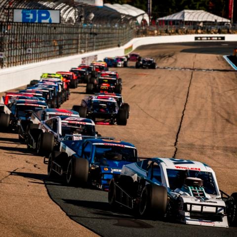 Four-time NASCAR Whelen Modified Tour champion Justin Bonsignore, driver of the No. 51, leads the Mohegan Sun 100 field into turn one at New Hampshire Motor Speedway on Sept. 20, 2025.