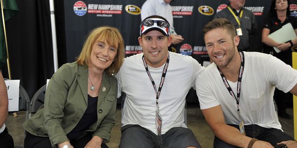 Josh McDaniels (center) was a race dignitary in 2014 with then-Governor Maggie Hassan and Patriots WR Julian Edelman.