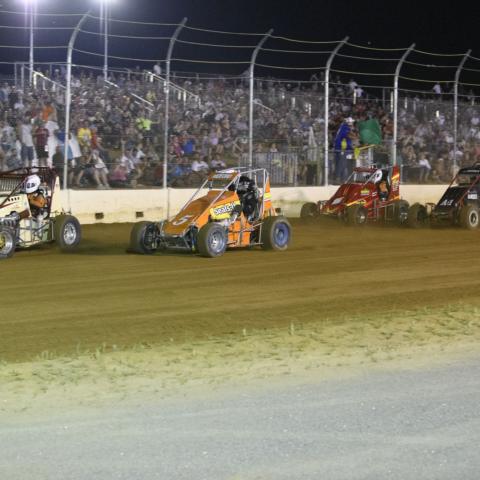 Race fans watch as the Dirt Midget Association races at The Flat Track at New Hampshire Motor Speedway during the inaugural Friday Night Dirt Duels on July 19, 2019.