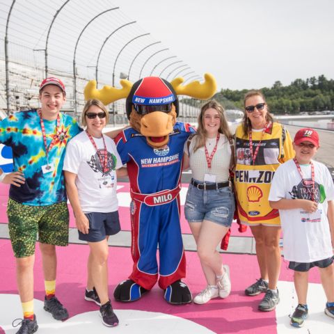 Race fans enjoy a walk around “The Magic Mile” with Milo the Moose during the July 16, 2022 Track Walk event at New Hampshire Motor Speedway to benefit the New Hampshire Chapter of Speedway Children’s Charities.