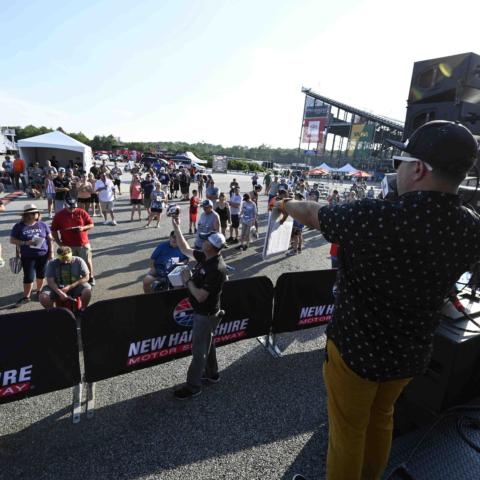 Jose Castillo (right) auctioning off items during the Wicked Good Live Auction to benefit the New Hampshire Chapter of Speedway Children’s Charities Friday, July 16 at New Hampshire Motor Speedway.