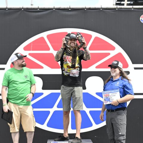 Kyle Belcher (center) of The Circle Jerks Podcast out of Providence, R.I. earned the win in Friday’s fifth annual Media Racing Challenge at New Hampshire Motor Speedway. Timmy G (left) of The Wicked Fast Podcast on 105.7 WROR-FM out of Boston, Mass. took second and Bob Bartis (right) of WSMN 95.3 FM/1590 AM out of Nashua, N.H. took third.