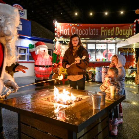 Santa Claus roasted marshmallows on Dec. 3, 2023 with a local family at New Hampshire Motor Speedway during Gift of Lights presented by Ambetter and Wellcare.
