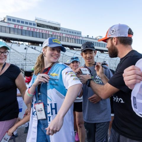 Ross Chastain, NASCAR Cup Series driver of the No. 1 Trackhouse Racing Chevrolet, signed autographs while leading the Track Walk presented by LeMay Family Goodworks to benefit the New Hampshire Chapter of Speedway Children’s Charities at New Hampshire Motor Speedway on Sept. 20, 2025.