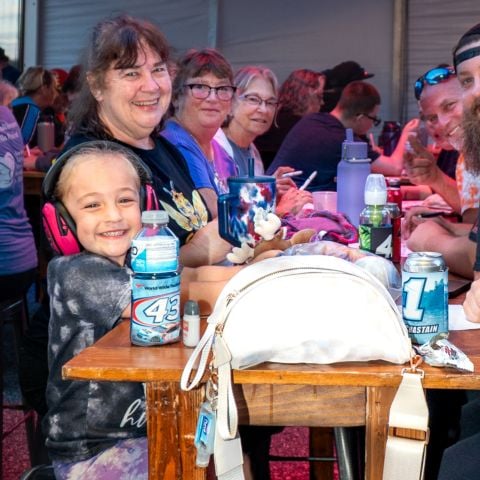 A family enjoying Musical Bingo at The Groove at New Hampshire Motor Speedway on Sept. 17, 2025 to kick off New England’s only NASCAR Cup Series weekend.