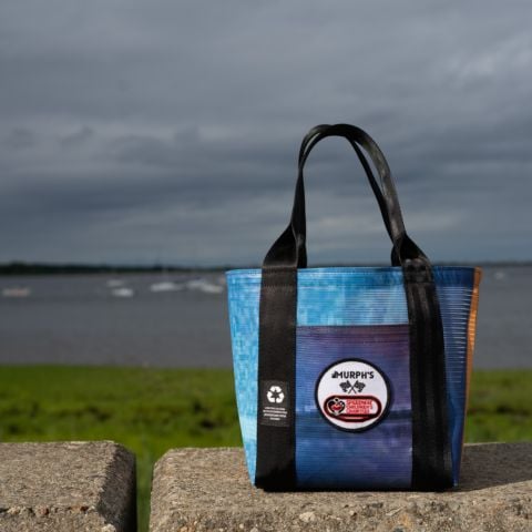 New Hampshire Motor Speedway (NHMS) has teamed up with Murph’s NH to create a collection of unique reusable bags made from recycled banners from past NHMS events. The bags are available in two sizes and a portion of the proceeds benefit the New Hampshire Chapter of Speedway Children’s Charities.