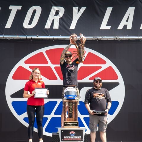 Kyle Belcher (center) of The Loose is Fast Podcast out of Providence, R.I. earned his second Media Racing Challenge win at Friday’s eighth annual event at New Hampshire Motor Speedway. Claire Overton (left of center) of WWLP-TV/22 News out of Springfield, Mass. took second and “Scumbag Steve” Helveston (right of center) also of The Loose is Fast Podcast took third.