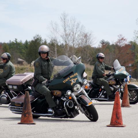 New Hampshire State Police motorcycle officers navigating through a training course at New Hampshire Motor Speedway on May 6, 2022.