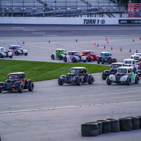 Shaun Buffington (far left) leads the Granite State Legends Cars field through the first of two chicanes on New Hampshire Motor Speedway’s 1.6-mile full road course Sept. 25, 2021.