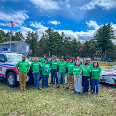 New Hampshire Motor Speedway staff members at Robert L. Landry Sr. Memorial Field in Loudon, N.H. after sprucing it up for the sixth annual Speedway Cares Day.
