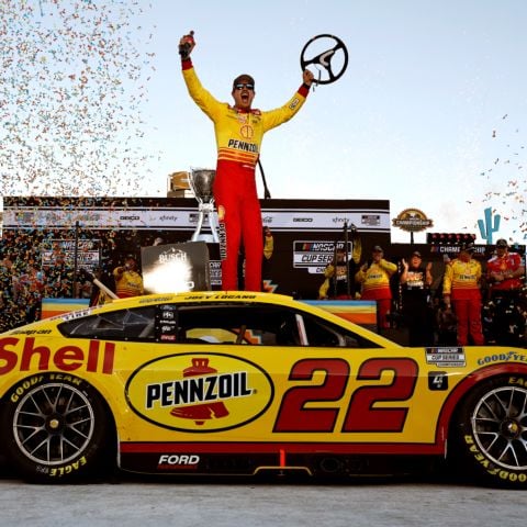 Joey Logano, driver of the No. 22 Team Penske Ford, celebrates in victory lane after winning the NASCAR Cup Series Championship Race at Phoenix Raceway in Avondale, Ariz. on Nov. 10, 2024.