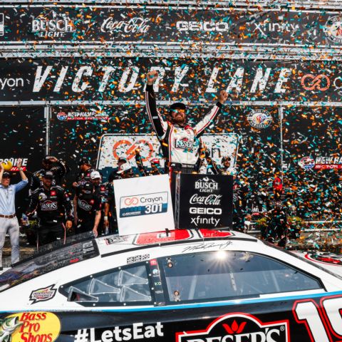 Martin Truex Jr. celebrated in victory lane after a dominant performance in Monday's Crayon 301 NASCAR Cup Series race at New Hampshire Motor Speedway.