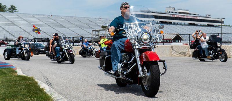 Riders take to the 1.6-mile road course at New Hampshire Motor Speedway during the Mae West Memorial “For the Love of Pets” Ride for the Humane Society on June 10, 2019.