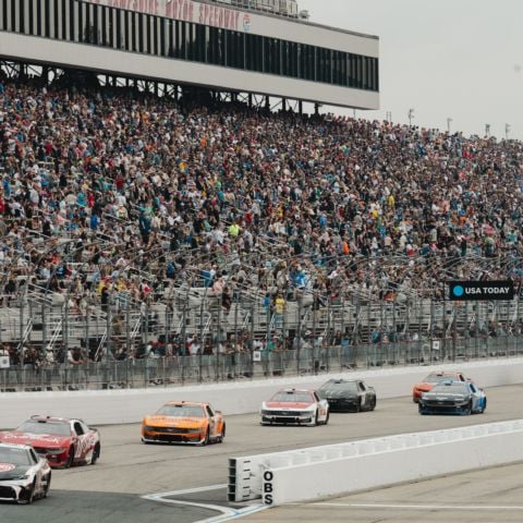 Christopher Bell, driver of the No. 20 Joe Gibbs Racing Toyota, leads the field into turn one at New Hampshire Motor Speedway during the NASCAR Cup Series race on June 23, 2024
