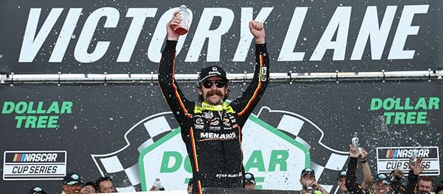 2023 NASCAR Cup Series champion Ryan Blaney, driver of the No. 12 Team Penske Ford, celebrates in victory lane at New Hampshire Motor Speedway following his second consecutive Cup Series win at “The Magic Mile” on Sunday.