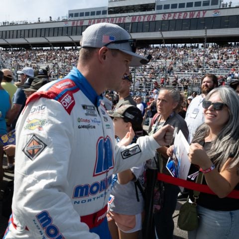 Ryan Preece, NASCAR Cup Series driver of the No. 60 RFK Racing Ford and Berlin, Conn. native, fist bumps fans at New Hampshire Motor Speedway on Sept. 21, 2025.