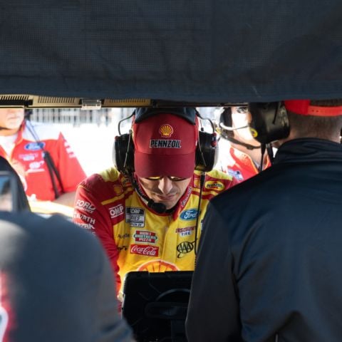 Pole sitter for the 2025 NASCAR Cup Series race at New Hampshire Motor Speedway Joey Logano, driver of the No. 22 Team Penske Ford, watches intently as the rest of the field qualified on Sept. 20, 2025.