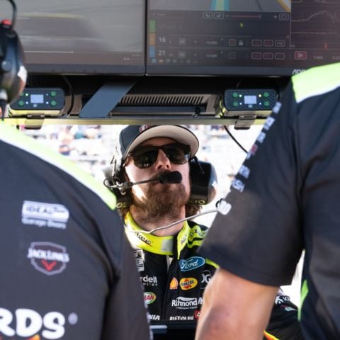 2023 NASCAR Cup Series champion Ryan Blaney studies with his Team Penske No. 12 teammates prior to winning the NASCAR Cup Series race at New Hampshire Motor Speedway on Sept. 21, 2025.