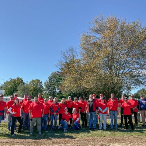 New Hampshire Motor Speedway staff members spent Wednesday morning scraping and repainting the fence at Loudon, N.H.’s oldest town cemetery for the third annual Speedway Cares Day.